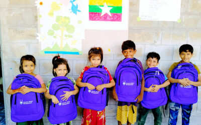 Distributing educational kits to FDMN children